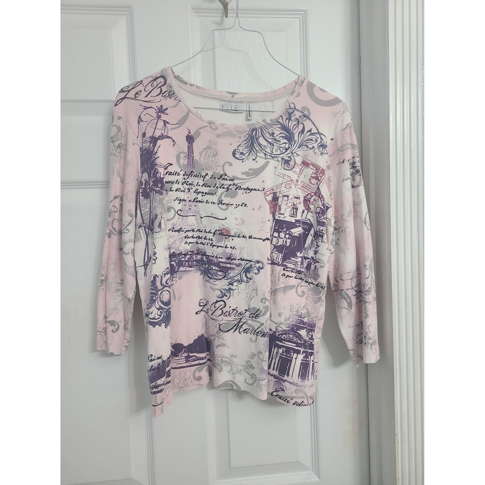 light pink 3/4-sleeve graphic top featuring a Paris-themed script and landmark L